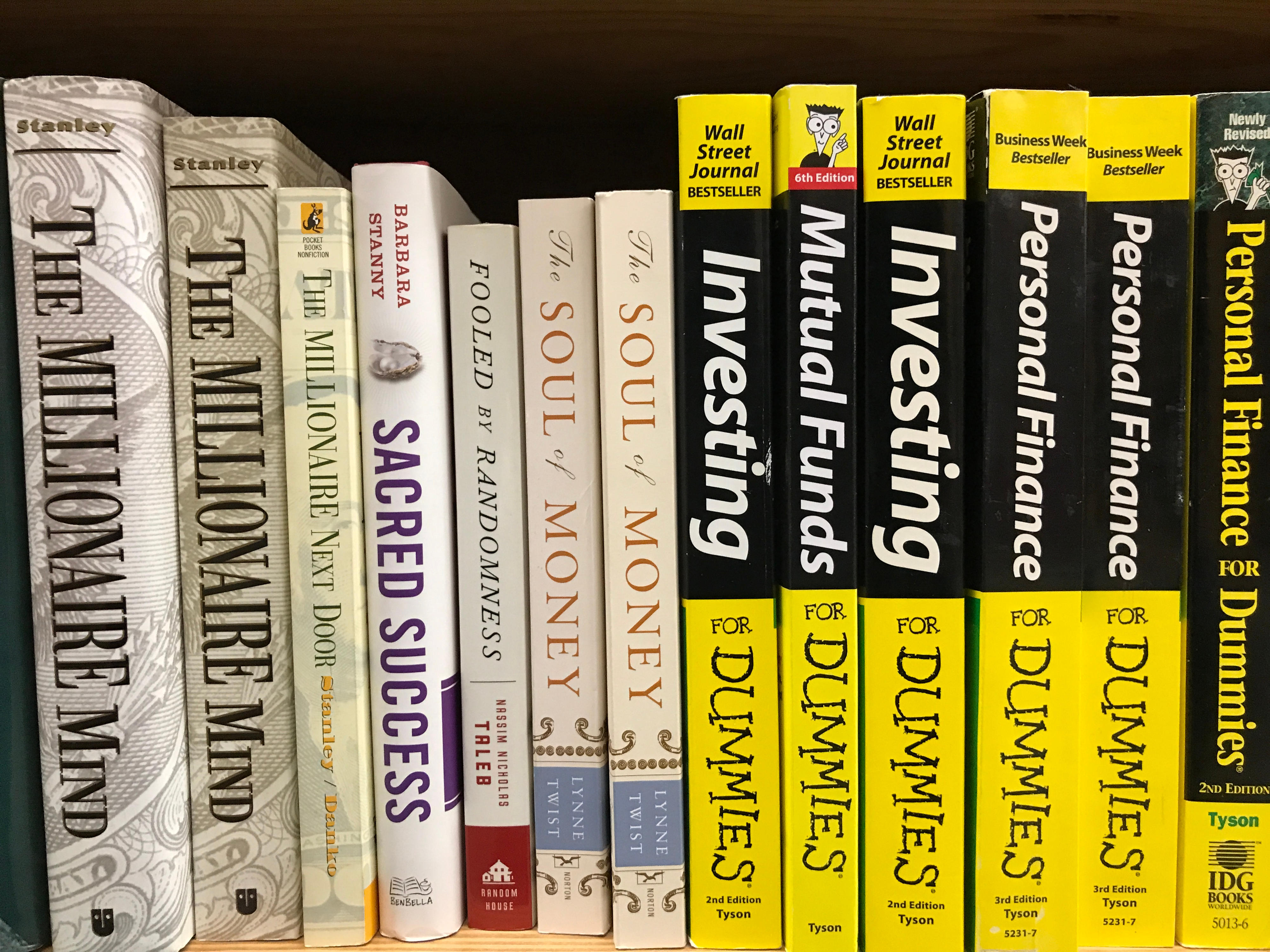 stack of finance books in shelf