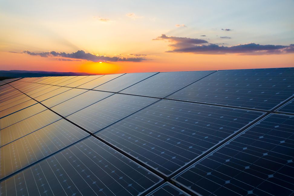 Solar panels in the sunset show an opportunity for sustainable investment and corporate sustainability activities. 