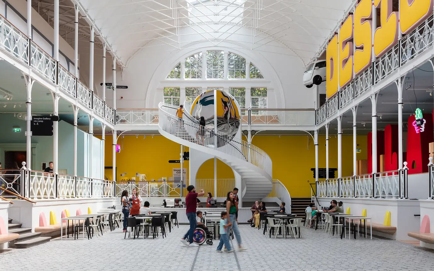 Gallery with people sitting and walking around