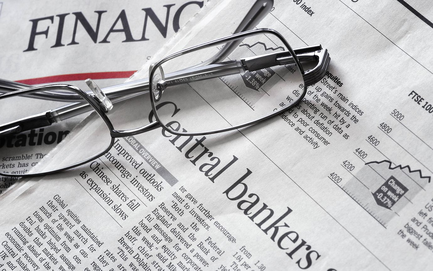 glasses on news paper, headline of 'Central bankers'