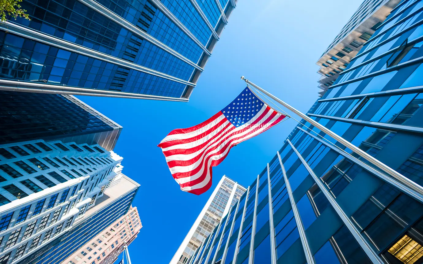 buildings, american flag, blue skies