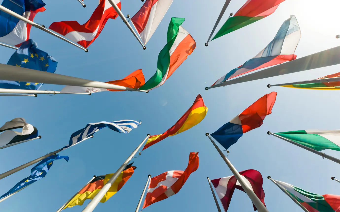upward view of flags in the sky