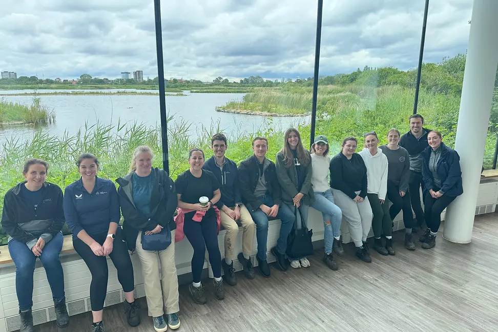Group of people sitting in a line