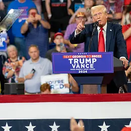 Trump stood at lecturn speaking at rally