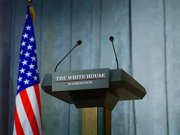 American flag and lecturn for government representative 