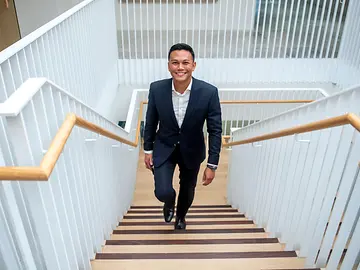 Investment person walking up stairs