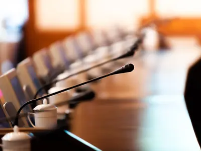 Boardroom with chairs and intercom system 