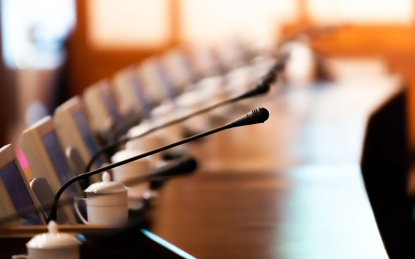 Boardroom with chairs and intercom system 