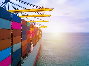 Ship with shipping containers out at sea